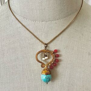 Gold tone red and blue beaded Tiklari pendant necklace